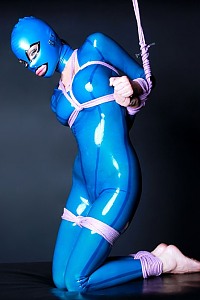 Ashley Renee in blue latex catsuit with mask gets bound in rope